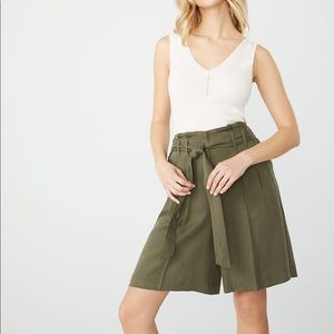High-waisted pleated bermuda Tencel shorts